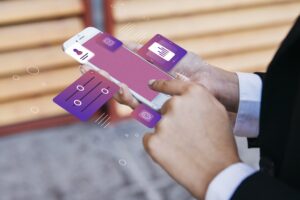 Person holding a smartphone with floating digital icons, symbolising cloud-based access, user control, and modern IT infrastructure.