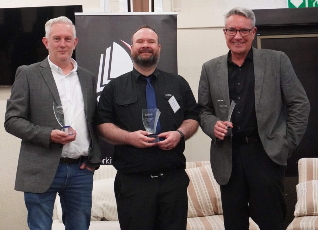 Prof Japie Greeff, winner of the SAPHE Excellence Award for Research and Innovation, with the award winners from Tsiba and the Foundation for Professional Development in the Teaching, Learning and Assessment and Community Engagement categories. (The person on the left is a representative of Tsiba but I will have to find out his name first as he was not the project owner; the person on the right is Dr Gustaaf Wolfvaardt from FPD)