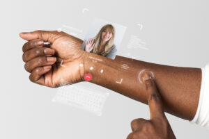 A wearable tech interface is projected onto a person’s forearm, showing a video call with “Jane Smith” and biometric data like heart rate. The interface includes touch controls, a virtual keyboard, and futuristic icons, illustrating advanced augmented reality and health-monitoring capabilities.