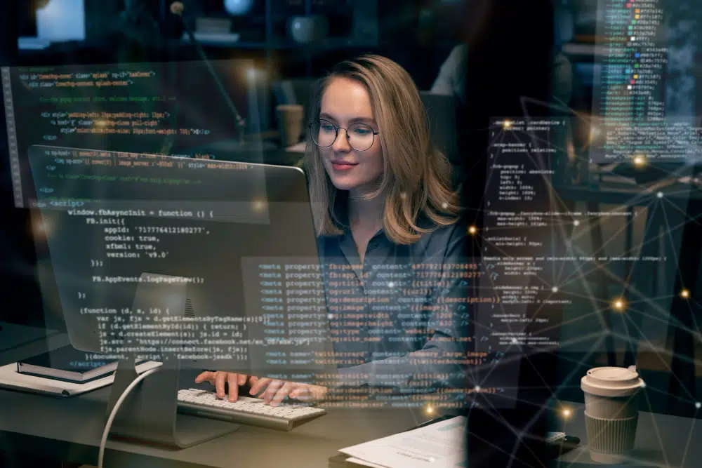 Female software developer wearing glasses types on a keyboard, surrounded by floating code screens and data networks.