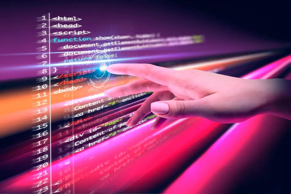 Programming course concept showing computer code on a digital screen being operated by touch